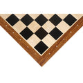Close-up of a corner on a 23 inch Ebony and Maple wood chessboard showing algebraic notations.