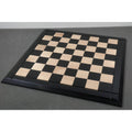 Full top view of the 25-inch Drueke style ebony wood and maple wooden chessboard without pieces.