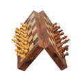 Open 10-inch golden rosewood magnetic travel chess set featuring finely carved wooden pieces.