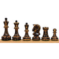 Full lineup of 1970s Dubrovnik ebonized/burnt boxwood chess pieces featuring the signature no-cross king and distinctive knight.