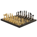 Full angled view of the 12-inch solid brass Warli tribal artwork luxury chess set in black and gold.