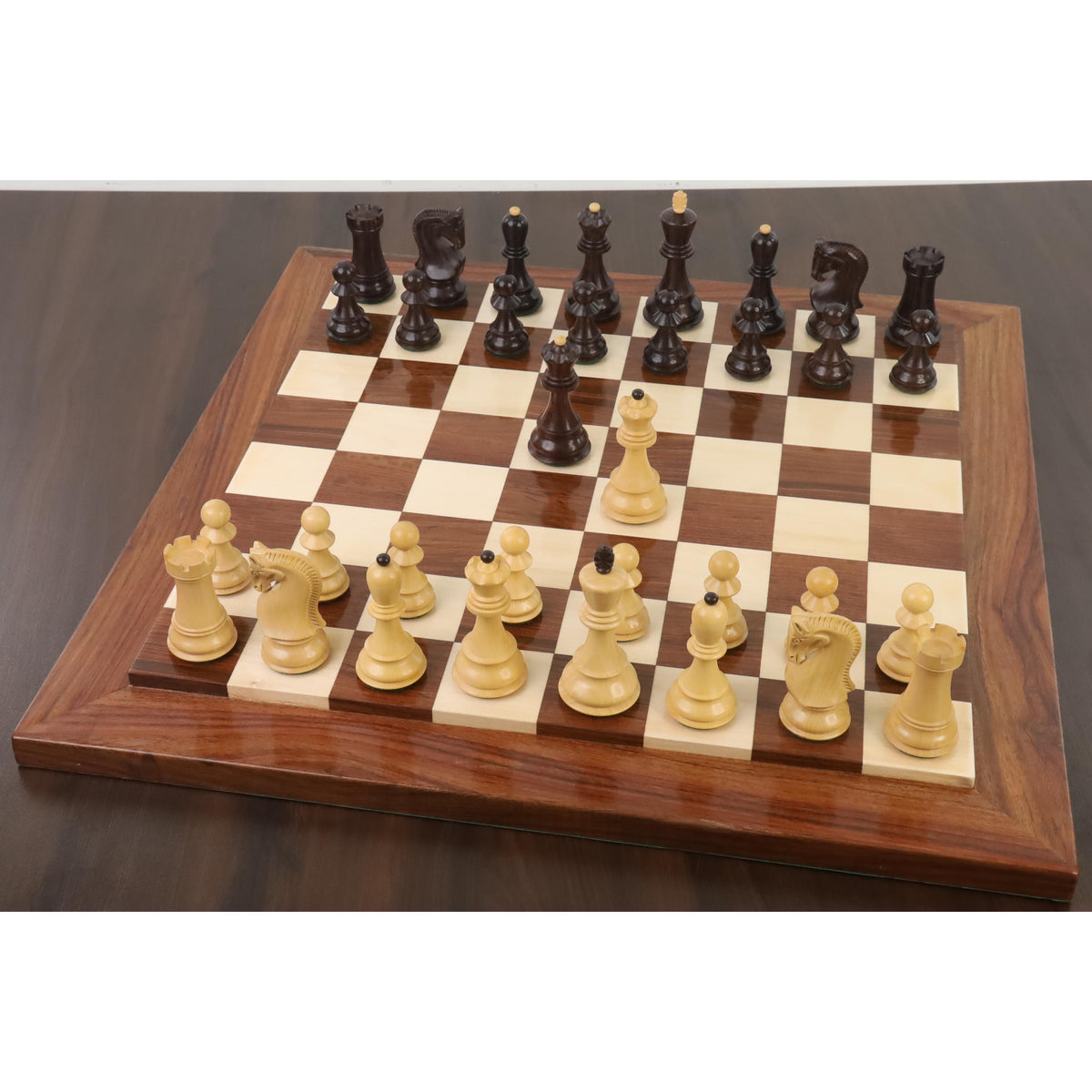 Russian Zagreb chess pieces set up on a luxury wooden board during a chess match.