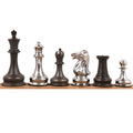Complete line-up of 1849 Jacques Staunton brass chess pieces in silver and grey finishes.