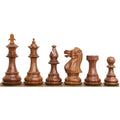 Line-up of weighted golden rosewood British Staunton chess pieces showcasing the King through Pawn.