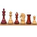 3.9" Craftsman Staunton double-weighted chess pieces lined up, showcasing the Bud Rosewood and Boxwood variations.