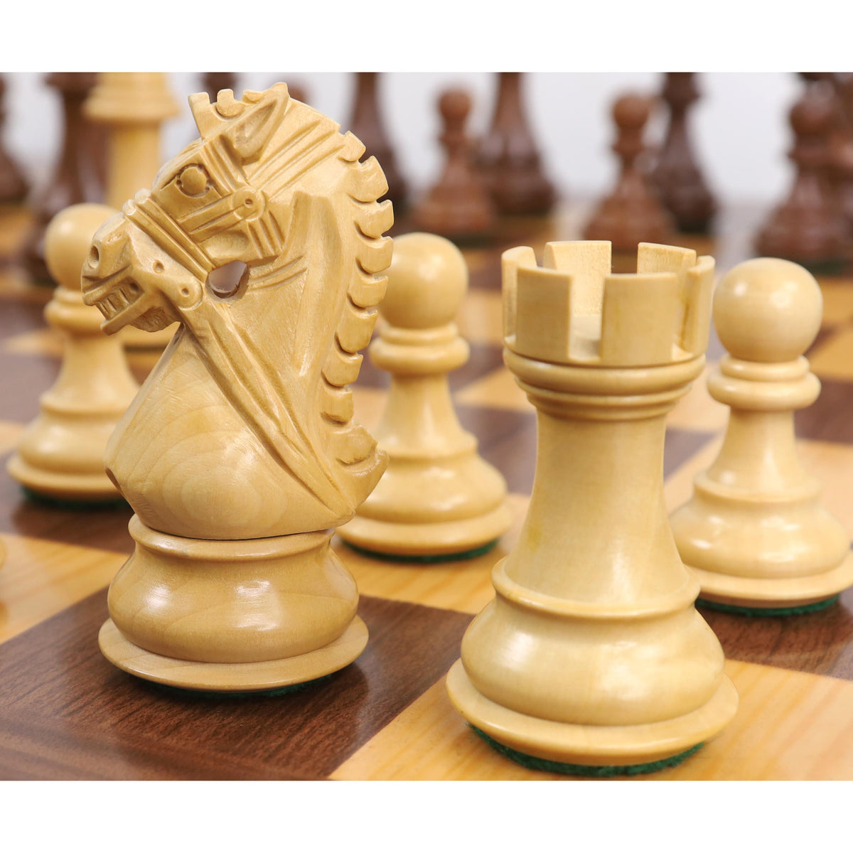 Detailed carving on a 4 inch boxwood knight piece from the Bridle Staunton luxury chess collection.