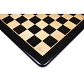Corner detail of the 21-inch solid inlaid ebony and maple wood chessboard showcasing its smooth black border.