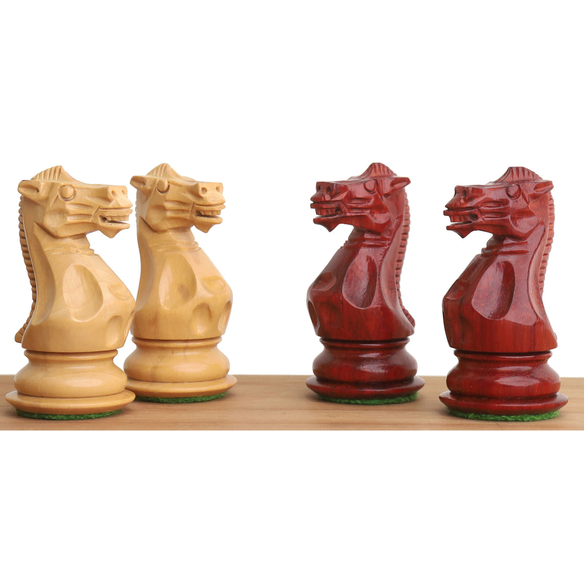 Hand-carved Pro Staunton chess knights in triple weighted Bud Rosewood and natural Boxwood.