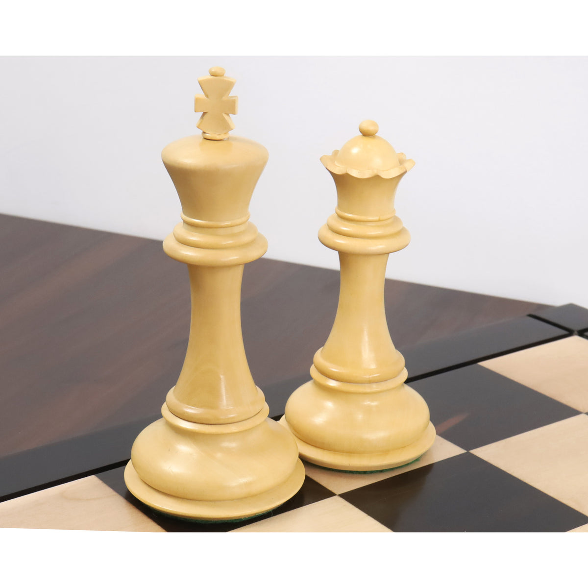 Boxwood king and queen pieces from the triple weight luxury Staunton chess pieces set displayed together.