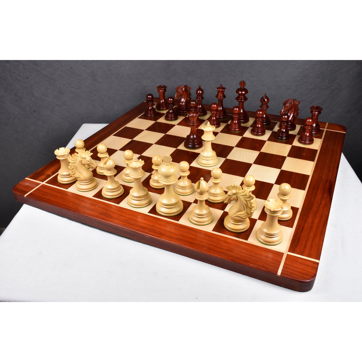 Full Alexandria luxury Staunton chess pieces set set up for a game on a 23 inch bud rosewood board.