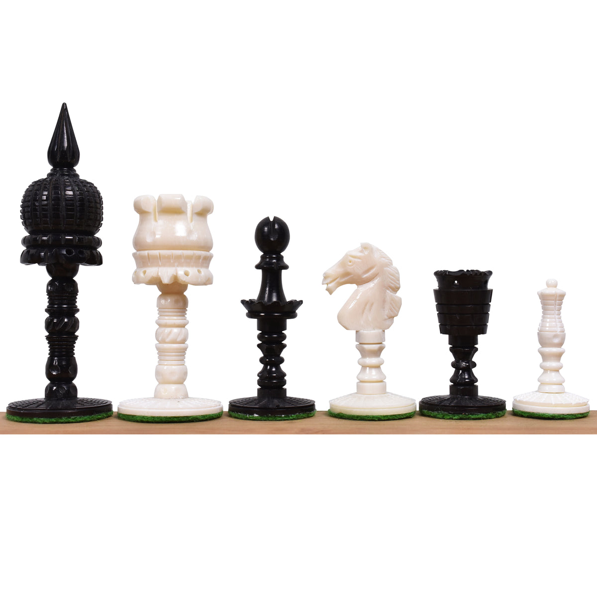 Lineup of alternating black and white English pre-Staunton camel bone chess pieces.