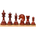 Six crimson bud rosewood Dragon luxury Staunton chess pieces standing in a row from King to pawn on wood.
