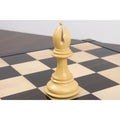 Premium boxwood bishop piece from the jumbo pro Staunton luxury chess set standing on a chessboard.