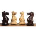 Four intricately carved knight pieces from the sleek Staunton luxury chess set, two rosewood and two boxwood, facing inward.