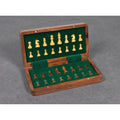 Wooden magnetic travel chess set pieces safely stored inside velvet-lined folding compartments.