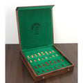 Interior of travel chess set with felt-lined storage slots and brand logo.