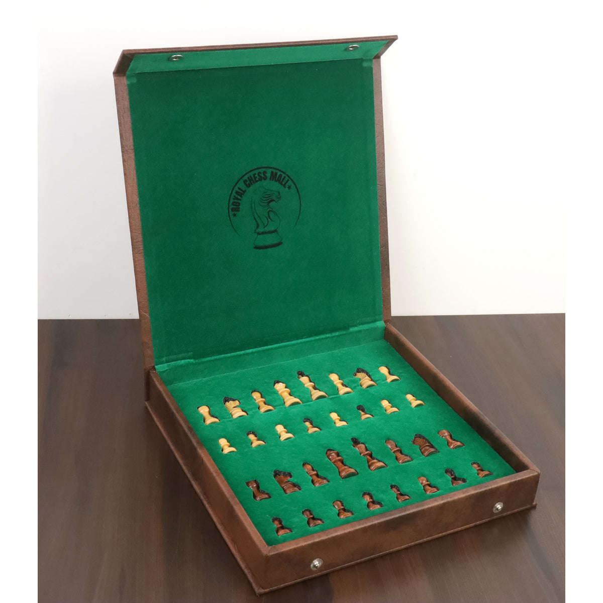 Interior of travel chess set with felt-lined storage slots and brand logo.