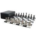 3.1" Tower Series brass metal chess pieces displayed on a marble board with a storage box.