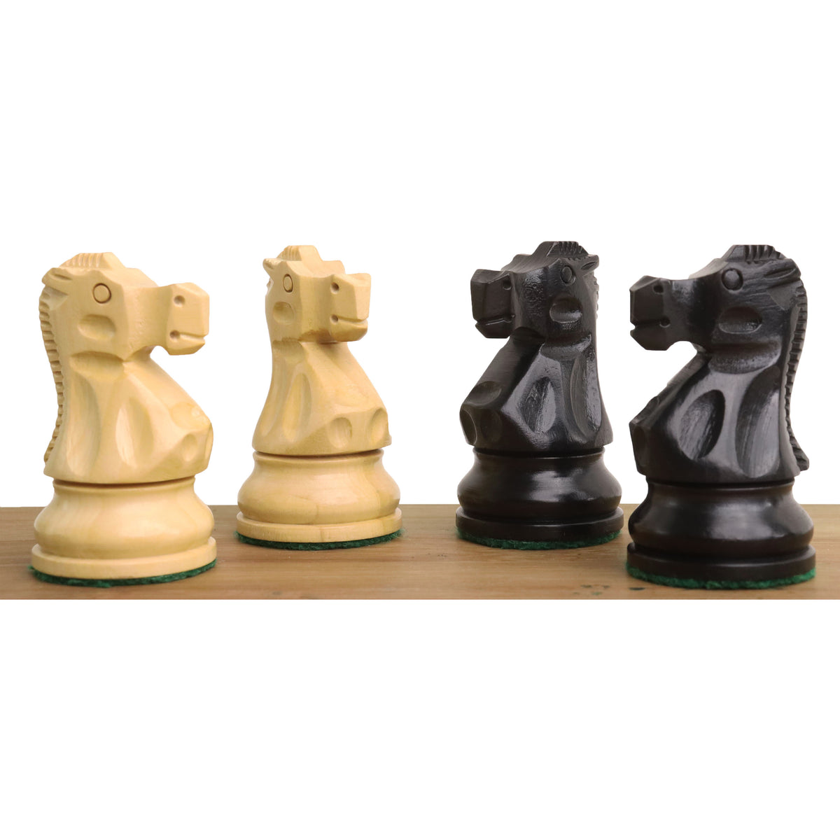 Complete front-facing lineup of ebonised boxwood pieces from the Reykjavik Series Staunton chess set.
