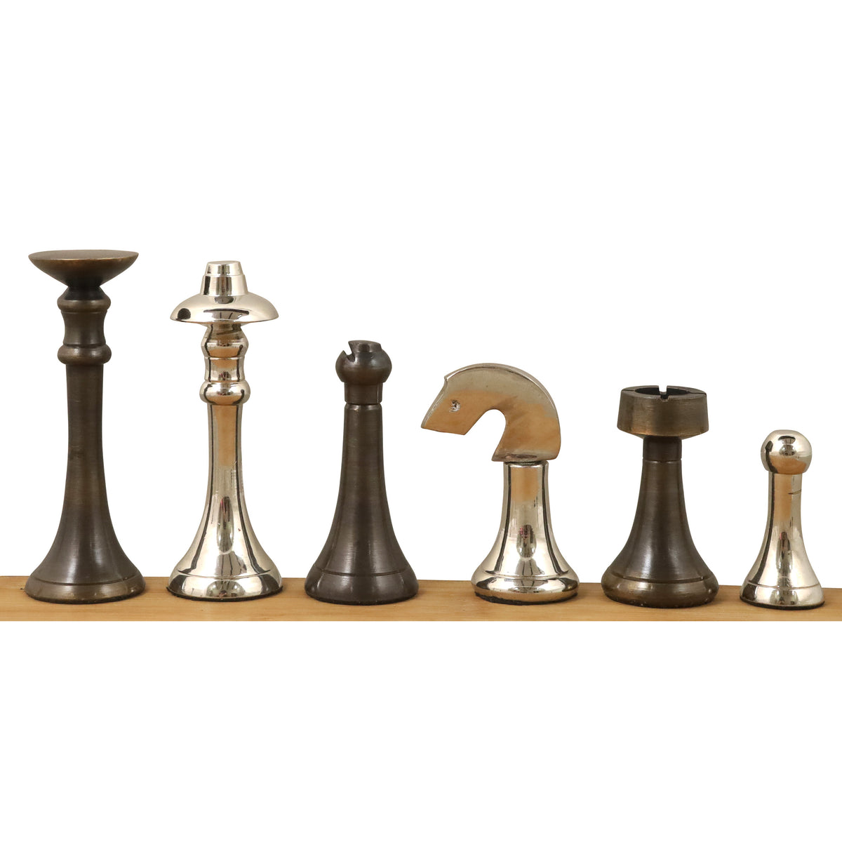 A line of luxury brass chess pieces displaying King, Queen, Bishop, Knight, Rook, and Pawn finishes.