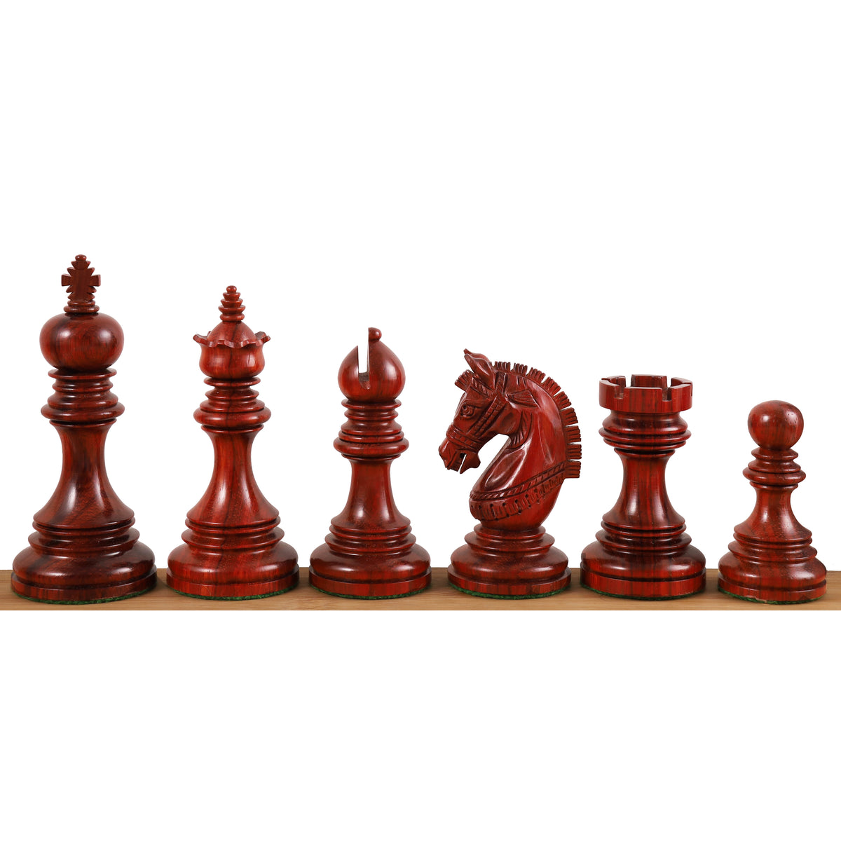 Dark bud rosewood Staunton chess pieces lined up in a row.