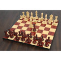 3.9 inch Bridle Staunton luxury chess pieces arranged on a polished wood board in an angled overview.