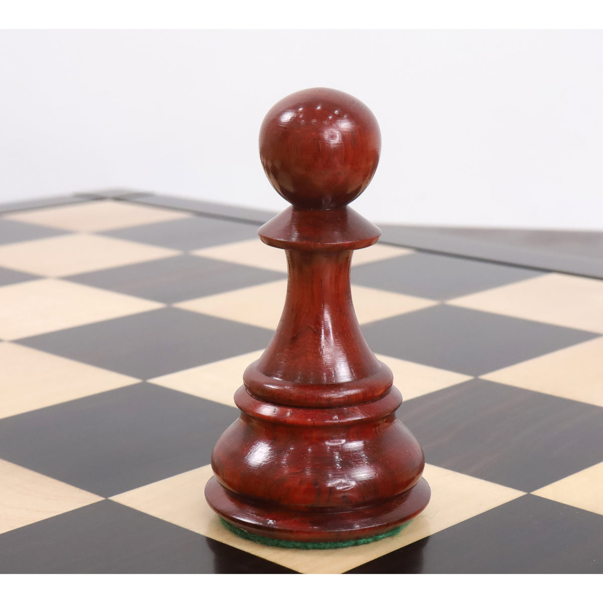 Polished bud rosewood pawn piece from the 6.3 inch jumbo pro Staunton luxury chess collection.