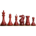 Six dark crimson bud rosewood sleek Staunton luxury chess pieces arranged by size on a wooden edge.