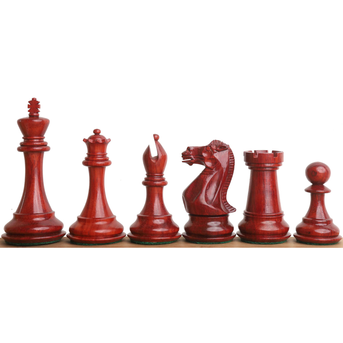 Six dark crimson bud rosewood sleek Staunton luxury chess pieces arranged by size on a wooden edge.
