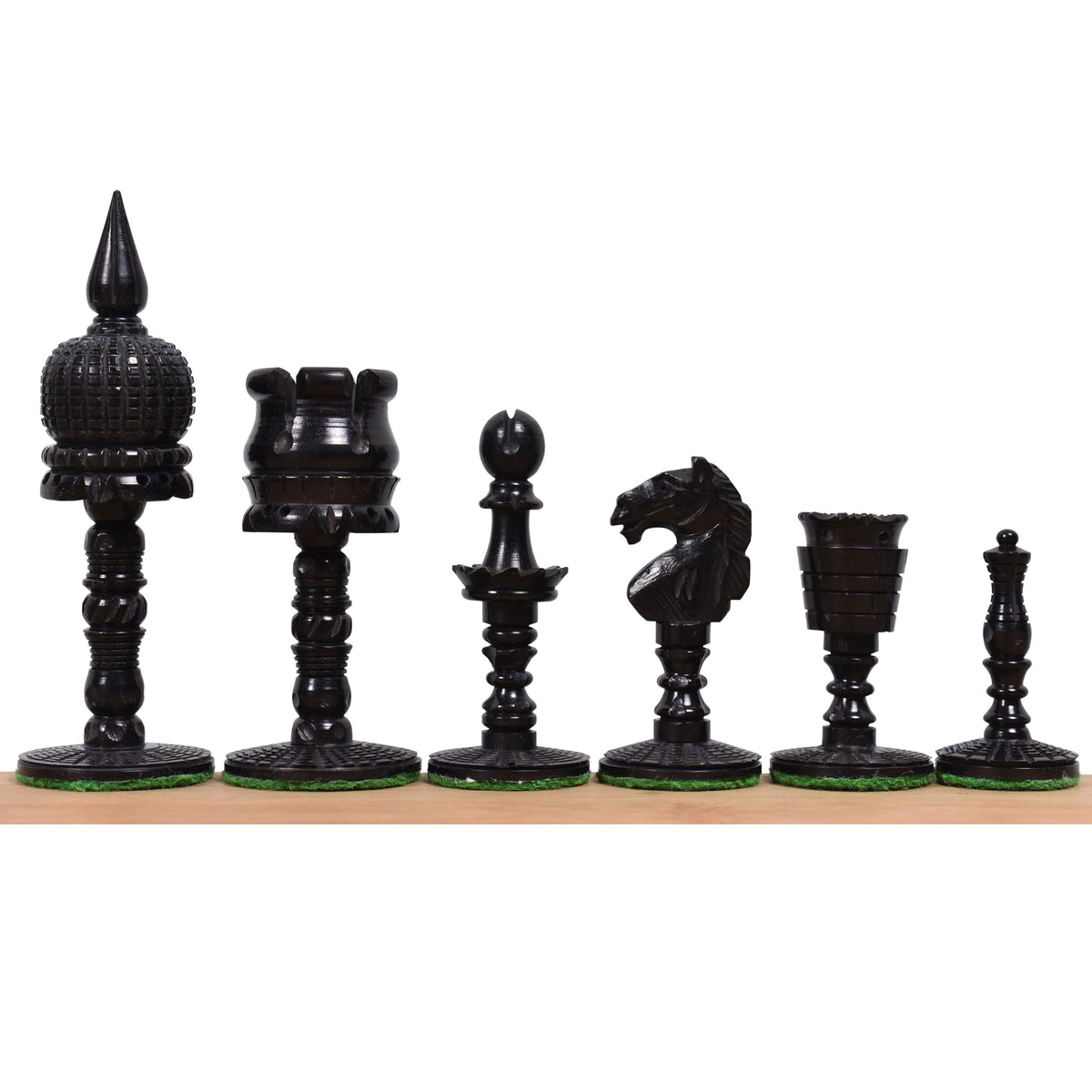 Black dyed camel bone English pre-Staunton chess pieces lined up in a row.