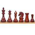 The dark Bud Rosewood pieces of the 3.9" Craftsman Staunton set lined up from King to pawn against a white background.