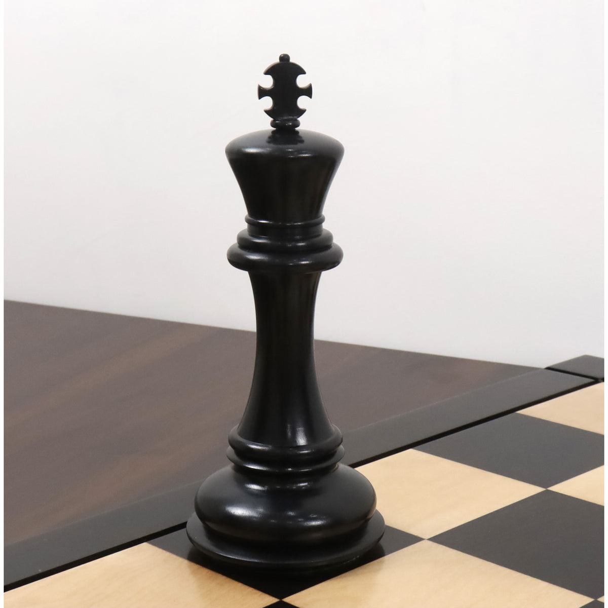 Detailed view of the 6.1-inch ebony wood king piece from the luxury Staunton chess set.