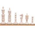 Lineup of six ivory white Minaret series hand-carved camel bone chess pieces against a white background.