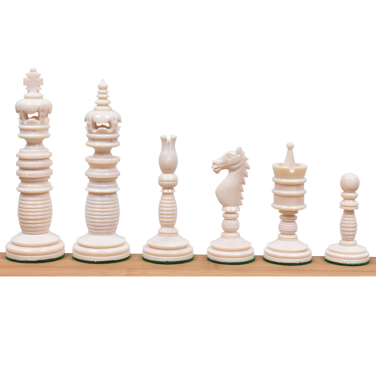 Lineup of six ivory white Minaret series hand-carved camel bone chess pieces against a white background.
