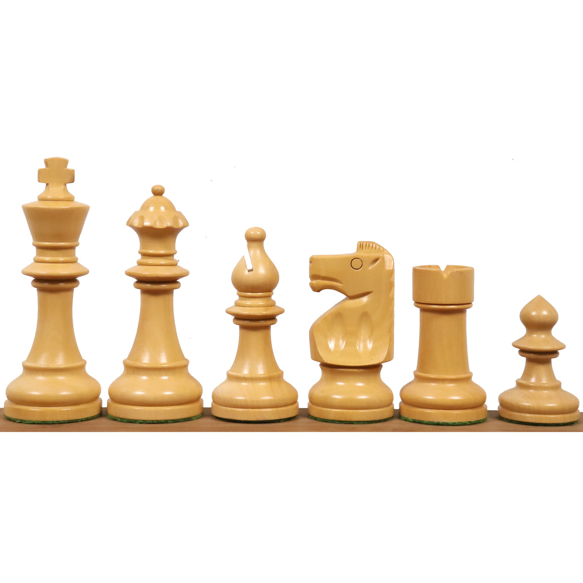 Complete lineup of white natural boxwood W.T. Pinney Staunton chess pieces arranged by height.
