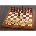 Luxury Pro Staunton chess set with triple weighted pieces arranged on a premium wooden chess board.