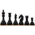 Set of black luxury Staunton chess pieces on a board.
