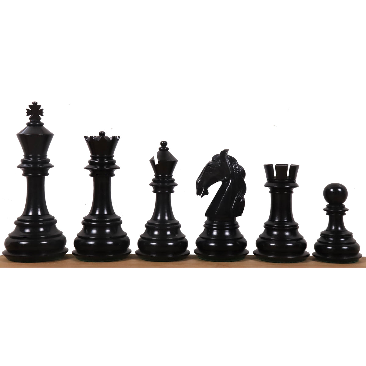 Set of black luxury Staunton chess pieces on a board.