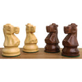 Side-by-side boxwood and golden rosewood knights from the Reykjavik Series Staunton chess set.