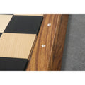 Detailed shot of the wooden border and engraved rank and file numbers on an Ebony and Maple professional chess board.