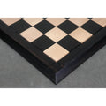 Detailed side view showing the thick ebony and maple wood blocks of the Drueke style board.