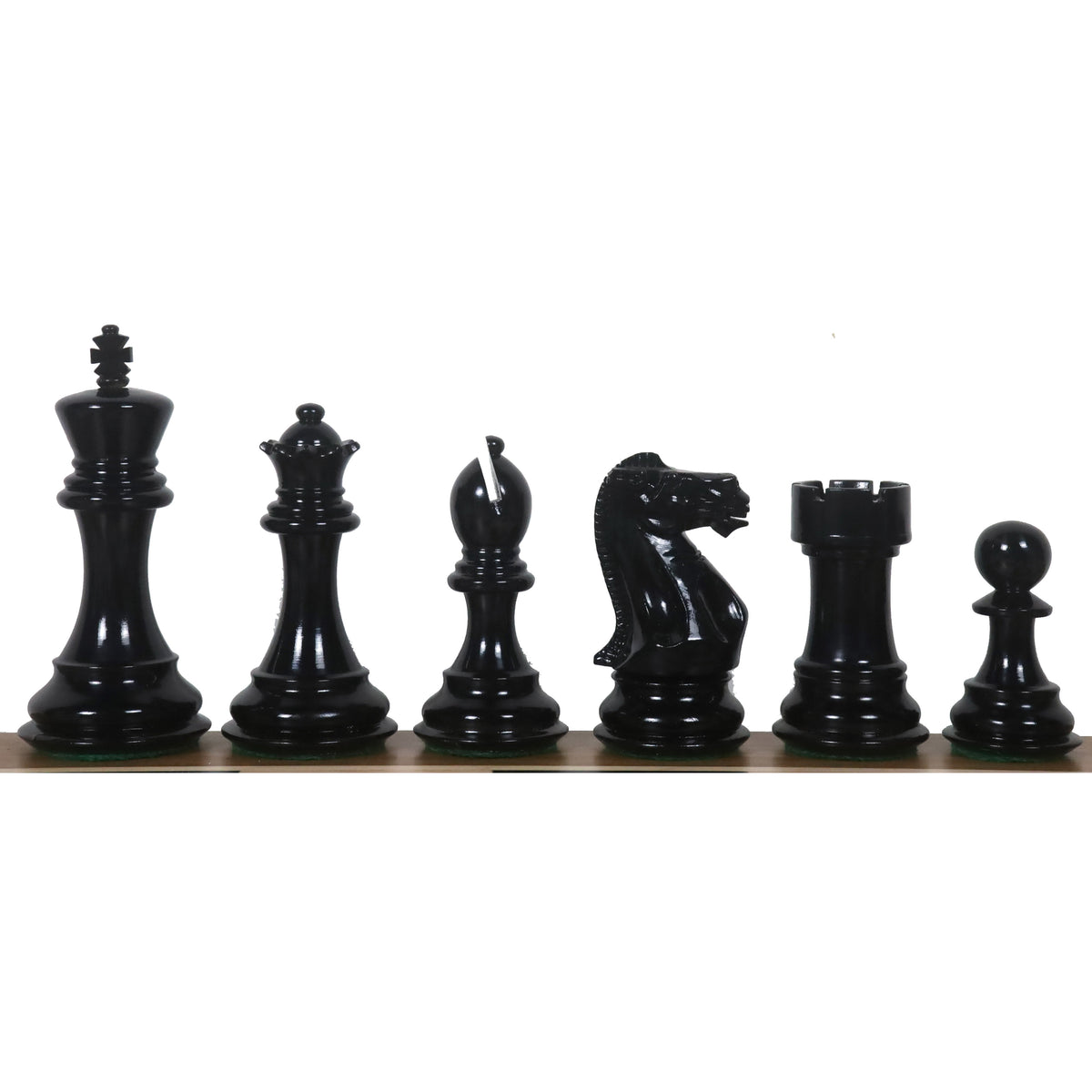 Six polished black lacquered wooden chess pieces standing in a row from King to Pawn.