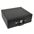 Closed black leatherette coffer storage box with a silver metal latch and structured handle.