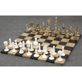 Complete 3.7" English Series Pre-Staunton antique camel bone chess pieces set up for play on a wooden chessboard.