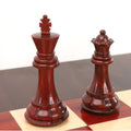 Premium 3.9 inch weighted bud rosewood king and queen pieces displaying rich grain textures on a chessboard.