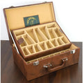 Tan brown leatherette coffer box open at an angle, displaying custom interior branding and velvet compartments.