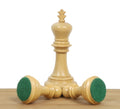 Standing light king flanked by two fallen 3.8" Imperial Staunton chess pieces displaying their green felt bases.