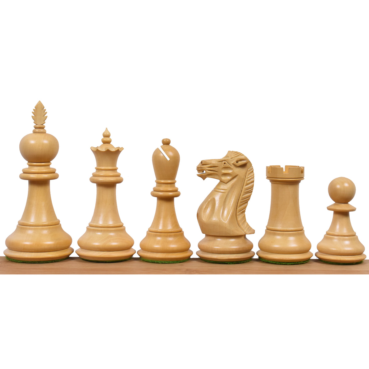 Light boxwood Staunton chess pieces lineup.