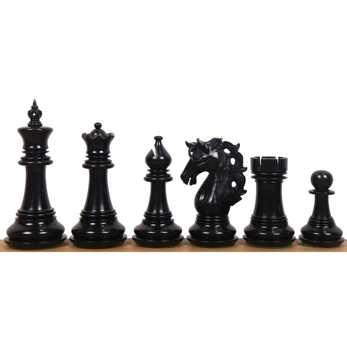 Black Spartacus luxury Staunton chess pieces lineup on a wooden surface.