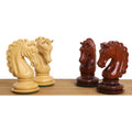 A collection of four knight chess pieces in contrasting bud rosewood and boxwood.
